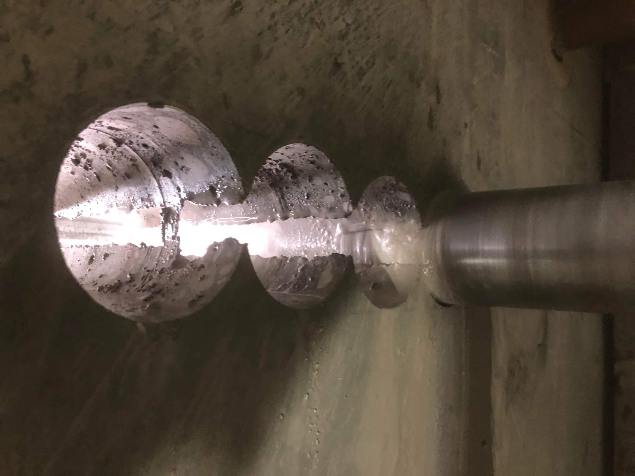 Worker cutting concrete